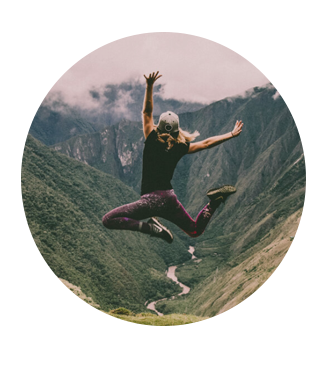 girl jumping in mountains
